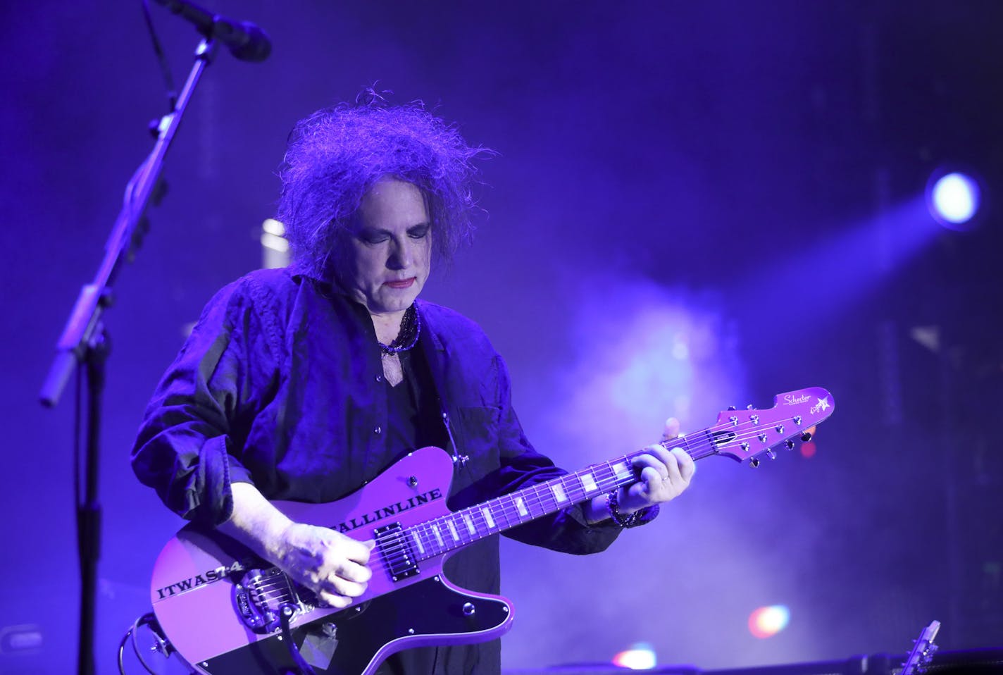 Robert Smith of The Cure, bathed in purple early in their show Tuesday night. ] JEFF WHEELER &#xef; jeff.wheeler@startribune.com The Cure Tour 2016 played Xcel Energy Center in St. Paul Tuesday night, June 7, 2016.