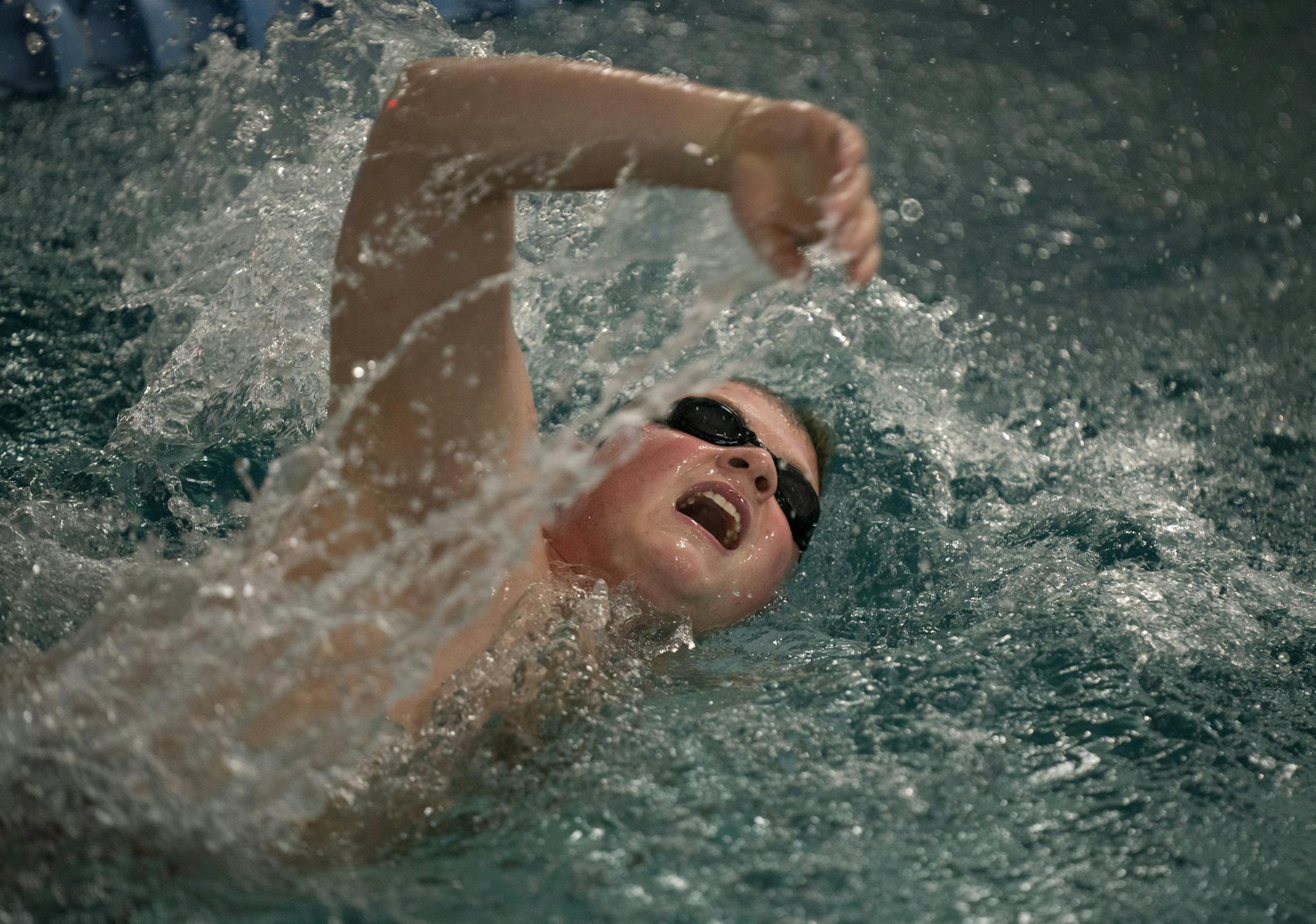 Roman Adams, 21, swam the freestyle stroke during a Saturday workout at the Clownfish Swim Club.