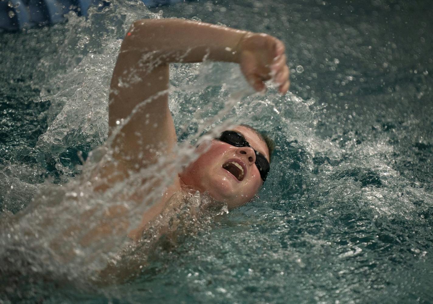 Roman Adams, 21, swam the freestyle stroke during a Saturday workout at the Clownfish Swim Club.