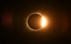 The moon passed in front of the sun for a total solar eclipse visible from Farmington, Mo.