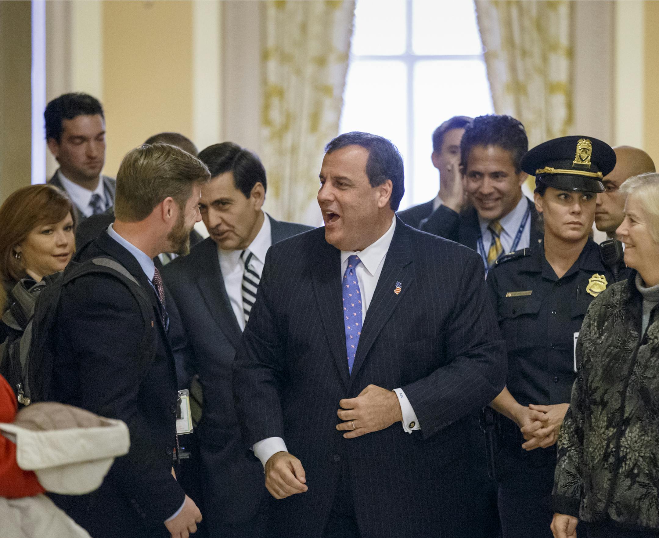 New Jersey Gov. Chris Christie leaves the Capitol in Washington, Monday, Nov. 17, 2014, after meeting with newly-elected GOP members of the House. Christie spoke at an orientation lunch for new lawmakers. (AP Photo/J. Scott Applewhite)