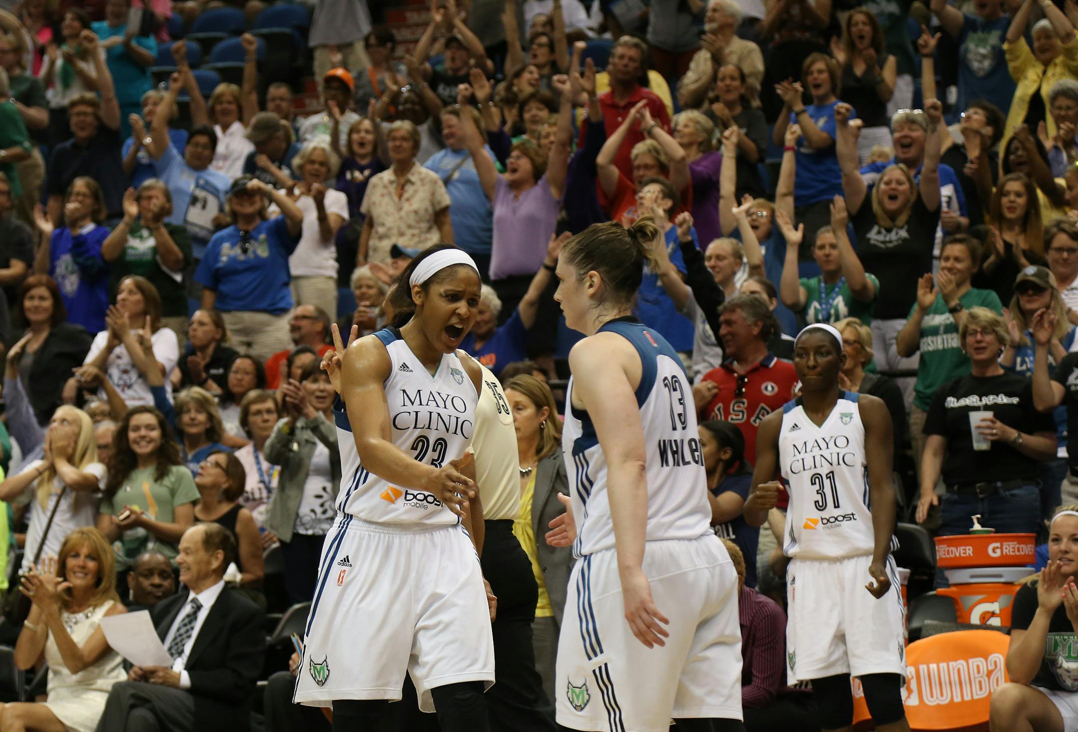 Maya Moore celebrated with Lindsay Whalen after she drew the foul from San Antonio's Heather Butler during the second half.