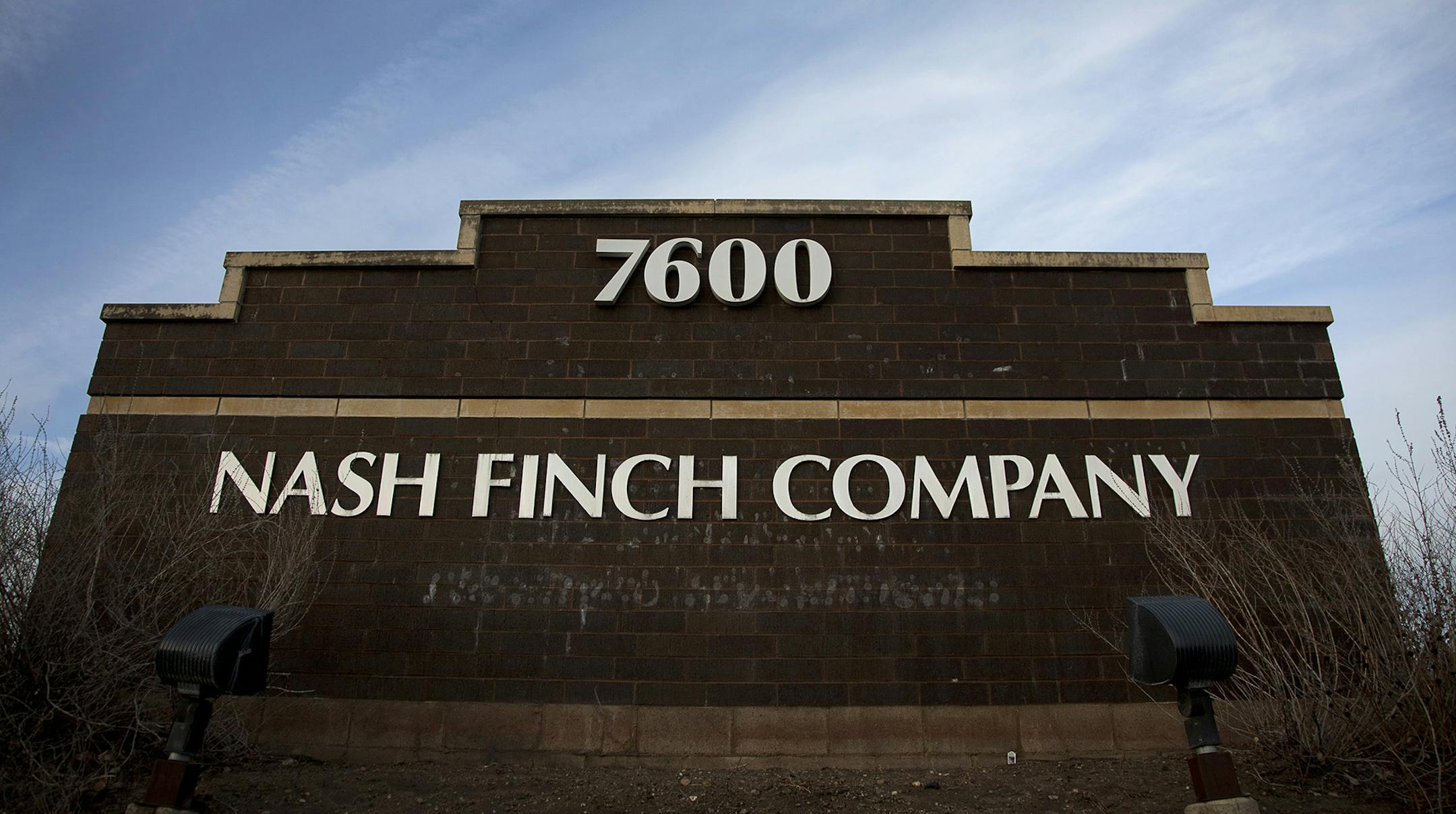 Nash Finch Co. signage is displayed outside of the company's headquarters in Edina, Minnesota, U.S., on Wednesday, Dec. 28, 2011. The economy in the Minneapolis area grew moderately in 2011, with strong growth in the agriculture, energy, and mining sectors and modest growth in consumer spending, tourism, residential and commercial construction, according to a report by the Federal Reserve Board. Photographer: Ariana Lindquist/Bloomberg ORG XMIT: 136462967