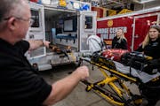 Ambulance services across Minnesota are suffering from staffing and funding shortages. Here, EMTs Brooke Yennie and Elise Braswell and paramedic John 