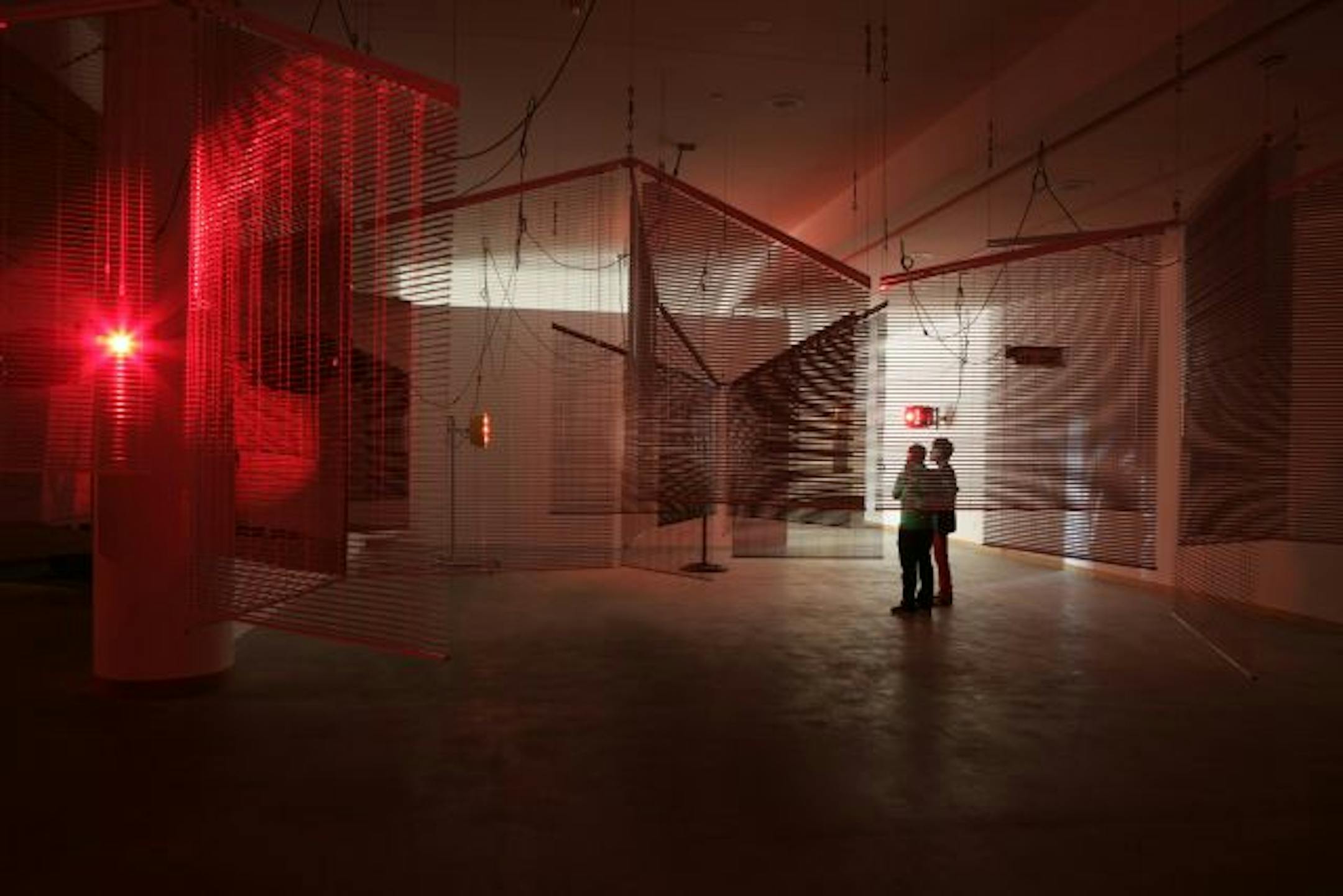 Aluminum blinds, colored lights, infrared heaters, fans and cables contribute to an atmosphere of light and shadow in Yang's installation, shown here as installed at REDCAT last year. Courtesy the artist and Galerie Barbara Wien, Berlin Photo � Scott Groller