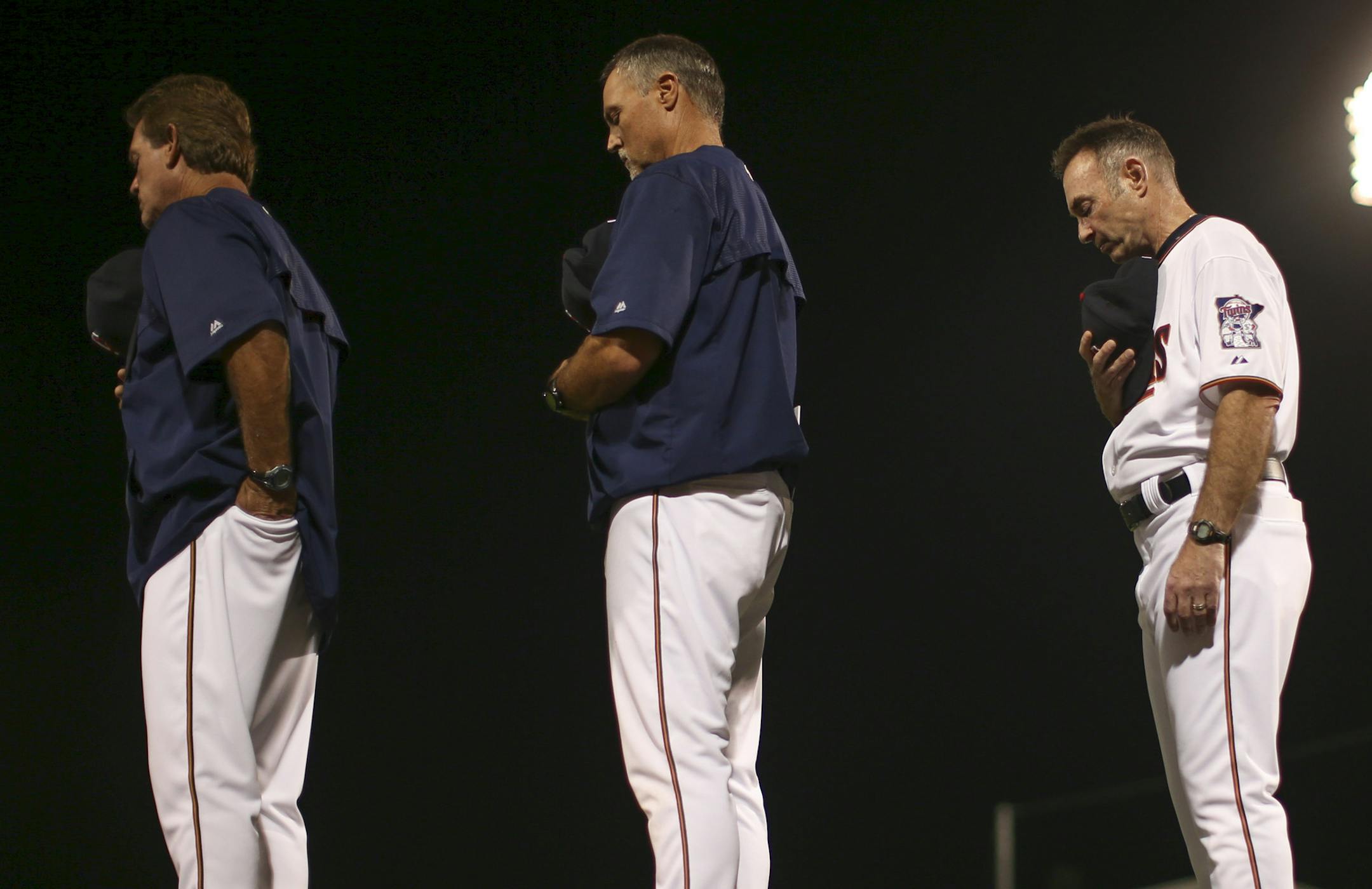 Coaches Neil Allen, Tom Brunansky, and manager Paul Molitor, from left, stood for the singing of the national anthem Wednesday evening at Hammond Stadium. ] JEFF WHEELER ï jeff.wheeler@startribune.com The Twins played their first exhibition game against the University of Minnesota baseball team Wednesday night, March 4, 2015, at Hammond Stadium in Fort Myers, FL.