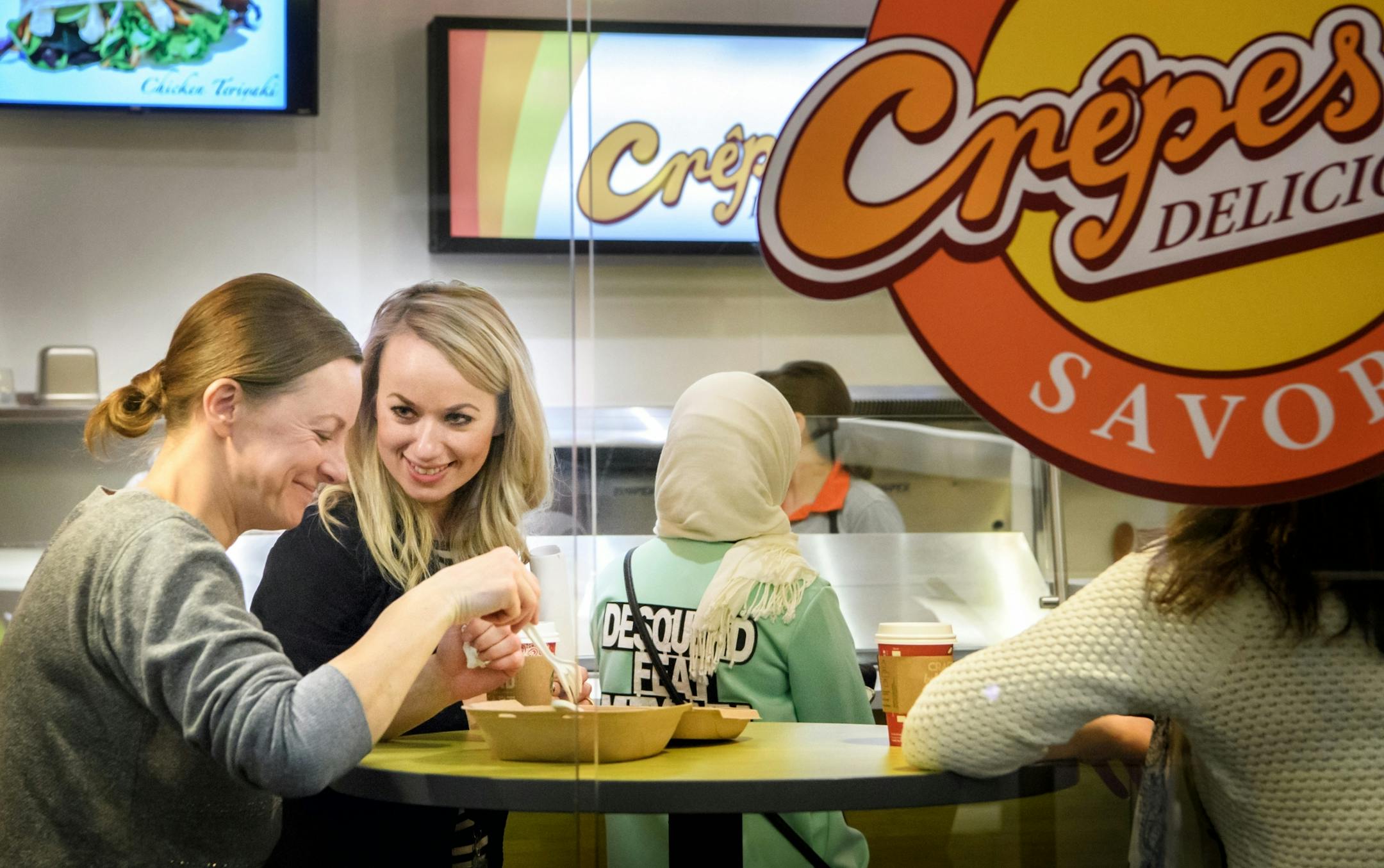 Instructor Polina Huffman checked in on student Valentina Nakonechnaya as she ate her crepe.