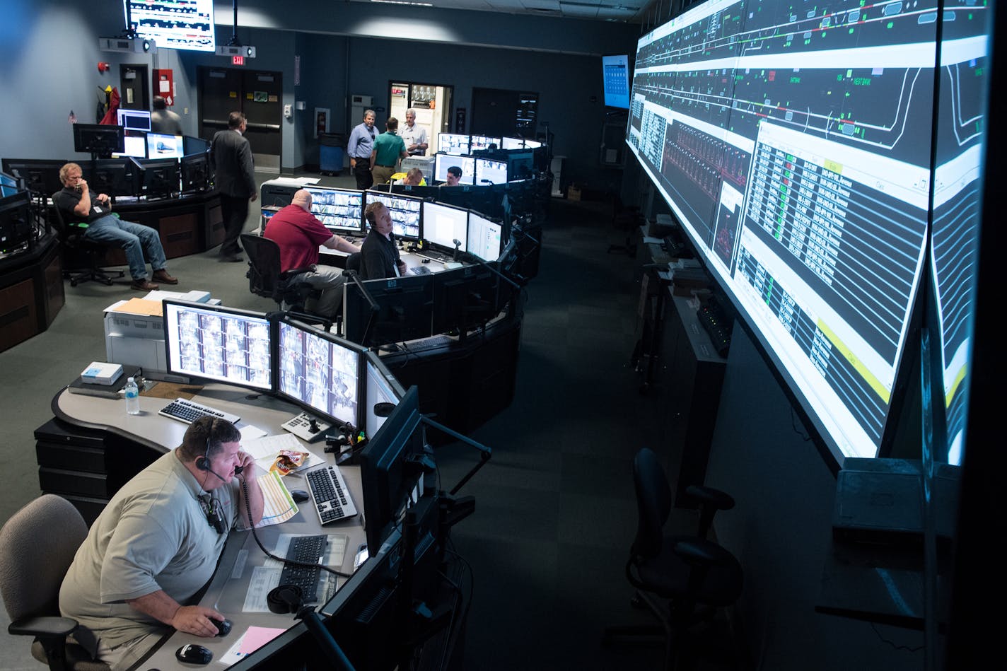 The scene inside the Metro Transit Rail Control Center as Metro Transit workers waited for Friday night's Luke Bryan concert to let out and the ensuing rush of rail traffic from US Bank Stadium. ] (AARON LAVINSKY/STAR TRIBUNE) aaron.lavinsky@startribune.com When events at US Bank Stadium and other large venues end, Metro Transit has the daunting task of shuttling thousands fans who use light-rail trains home. The Star Tribune gets a behind-the-scenes look at how that happens in a visit to the Ra