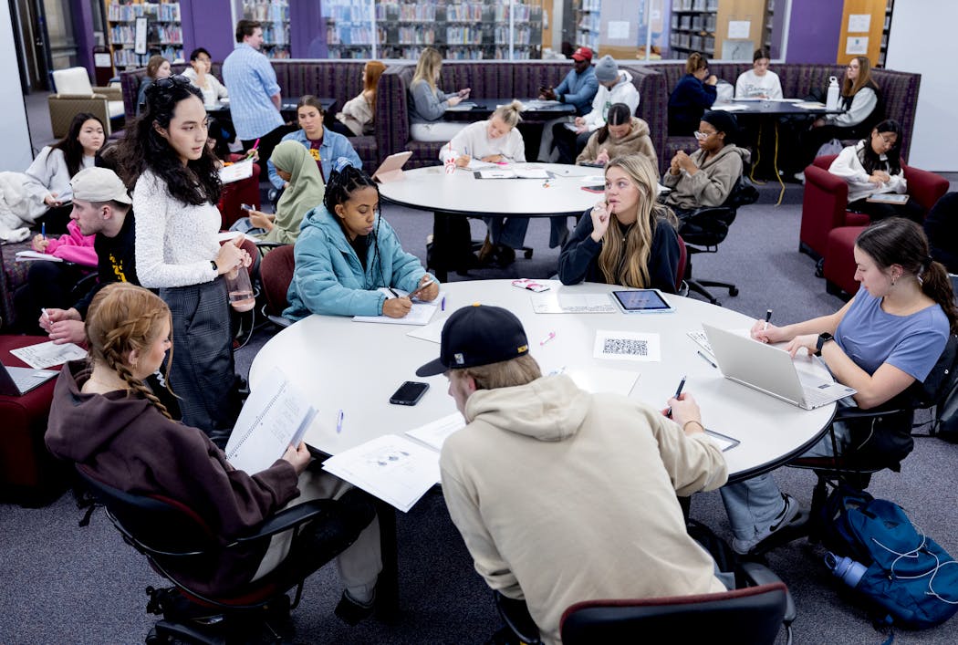 MavPASS leader Amal Sharafkhodjaeva (standing on left) worked with students during a MavPASS study session for a biology class, Monday at Minnesota State University, Mankato.