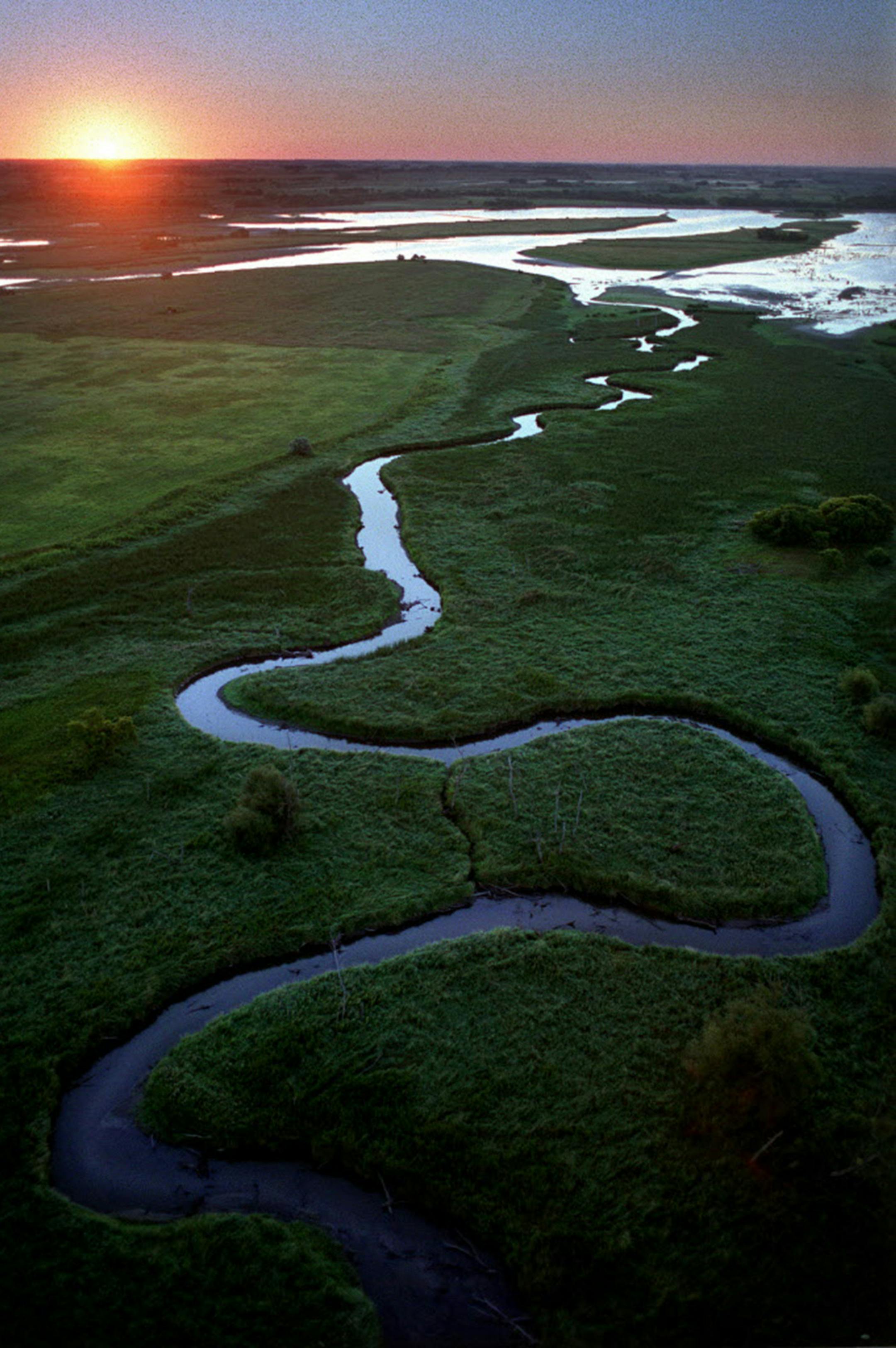 Near its beginning the Minnesota River is a beautiful place. Here, as it winds through Big Stone National Wildlife Refuge south east of Ortonville, the refuge serves as a major water fowl production and migration area and also contains more than 6,000 acres of grassland, including large tracts of native prairie. ORG XMIT: MIN2014091915422655 ORG XMIT: MIN1409191917113756