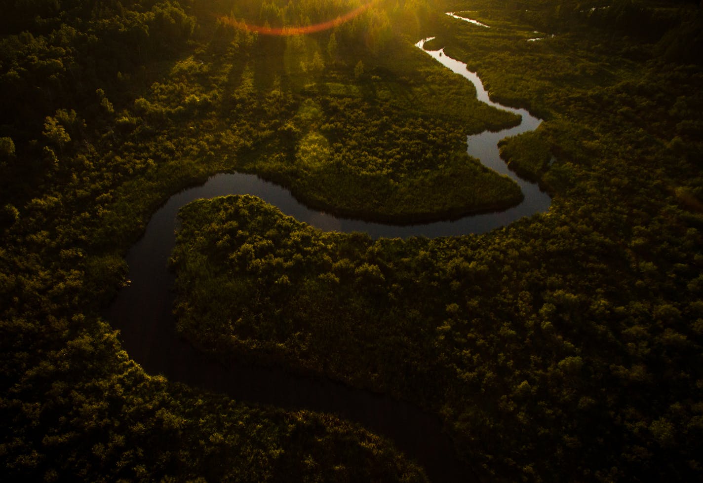 The Straight River meanders through a forested area south of Park Rapids, Minn. The Straight River is a tributary of the Mississippi threatened by an increase of agricultural pollution. ] (AARON LAVINSKY/STAR TRIBUNE) aaron.lavinsky@startribune.com RIVERS PROJECT: We look at three of Minnesota's rivers, including the Mississippi, Red and Chippewa, to see how land use effects water quality and pollution.
