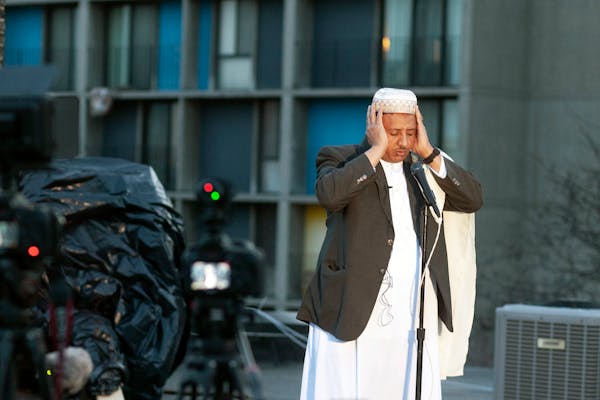 Ahmed Jamal, the mu’adhin of Dar Al-Hijrah Mosque, gave the call to prayer (adhan) from the mosque’s roof in the Cedar-Riverside neighborhood on A