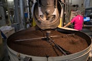 Coffee beans from around the world being roasted at the Caribou roastery in Brooklyn Center.