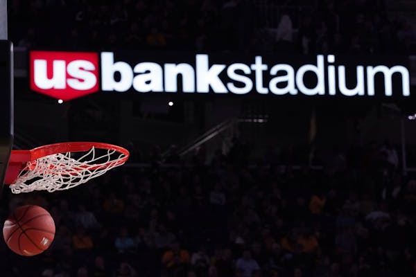 A basketball sailed in past the U.S. Bank Stadium logo as the Oklahoma State Cowboys warmed up.