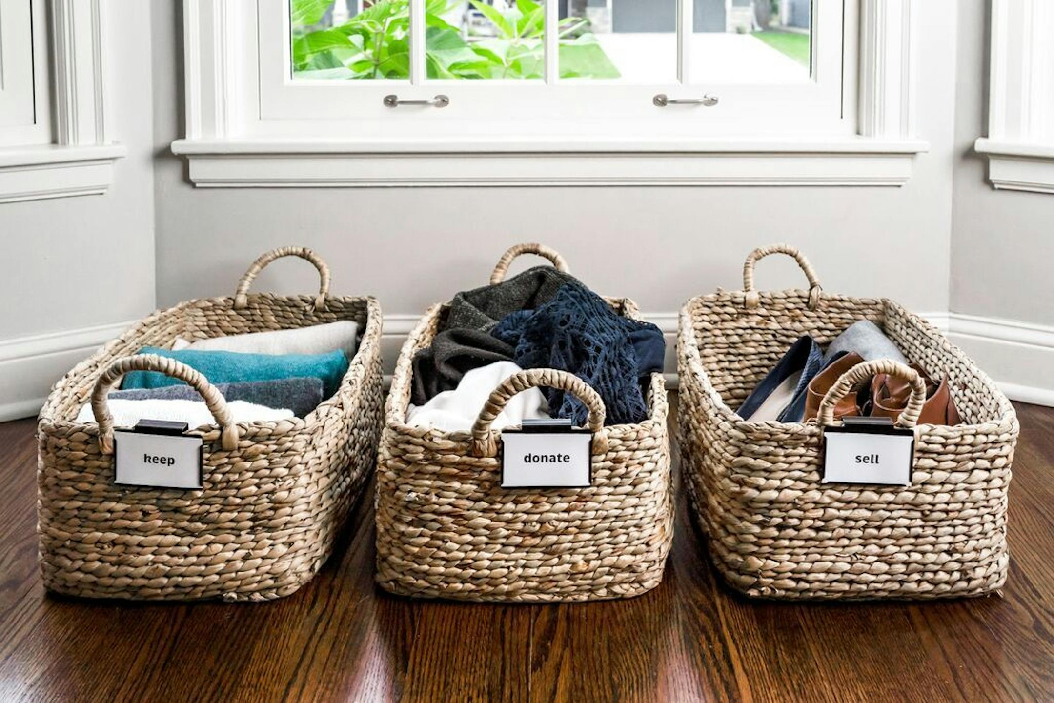 Baskets labeled "keep," "donate" and "sell."
