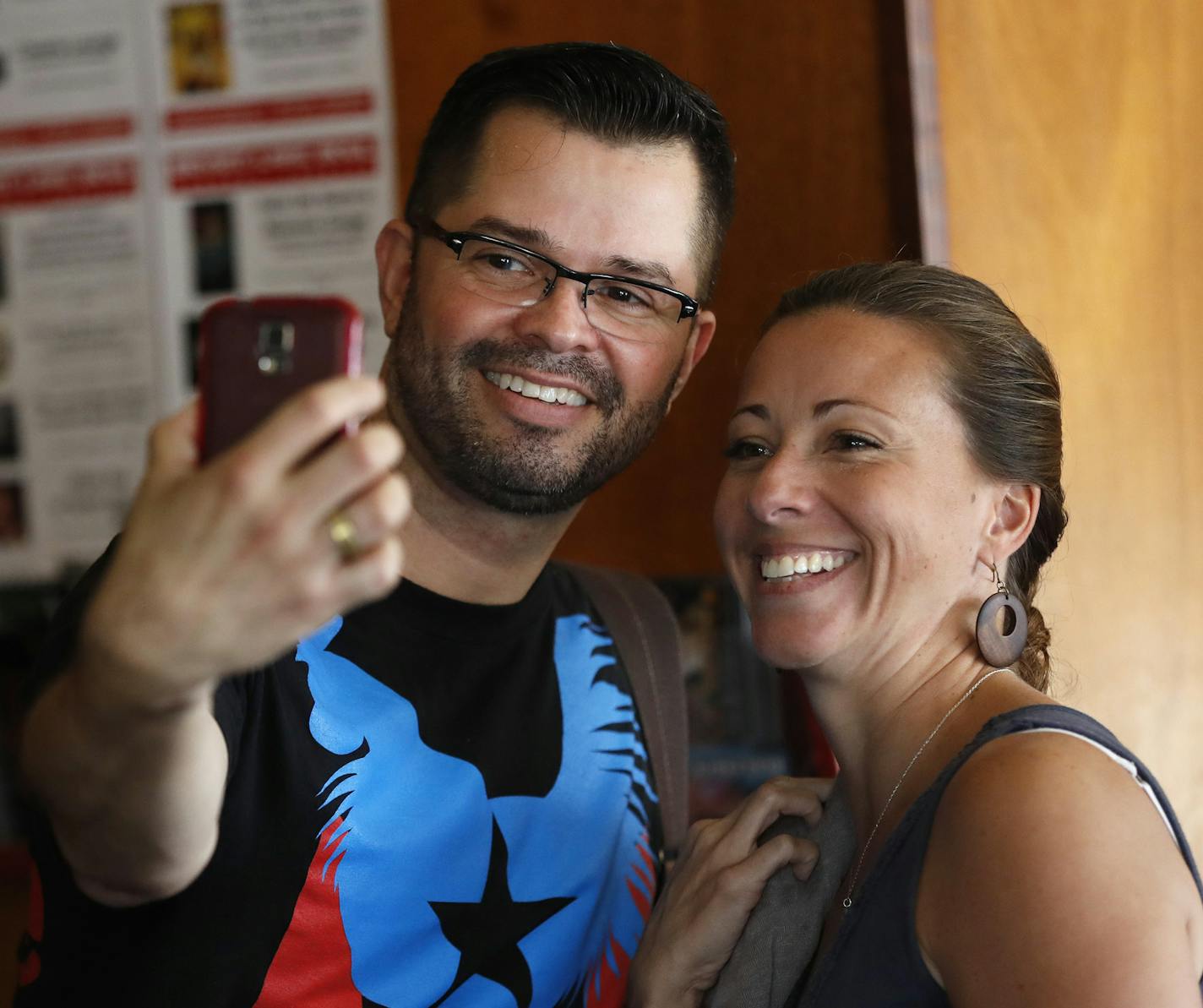 Javier Morillo left took a photograph with Vanessa Cintron after he performed his one -man show "Broken English, Mother Tongue" at Bryant-Lake Bowl on Aug. 14 in Minneapolis.