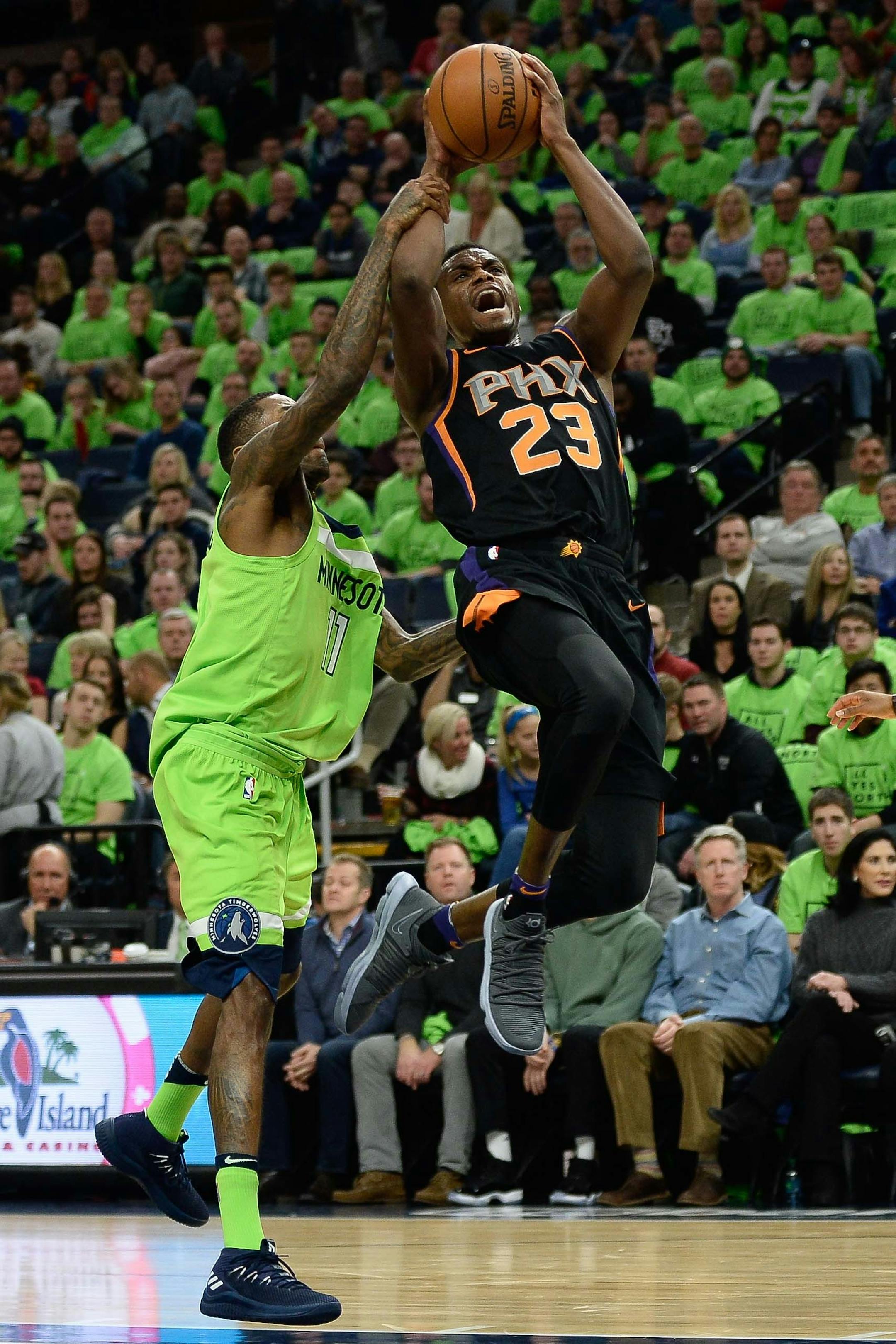 Phoenix Suns forward Danuel House Jr. (23) was fouled on the way to the basket by Minnesota Timberwolves guard Jamal Crawford (11) in the second quarter Saturday. ] AARON LAVINSKY ï aaron.lavinsky@startribune.com The Minnesota Timberwolves played the Phoenix Suns on Saturday, Dec. 16, 2017 at Target Center in Minneapolis, Minn.