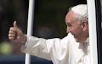 Pope Francis give the thumbs-up from the popemobile during a parade around the Ellipse near the White House in Washington, Wednesday, Sept. 23, 2015. 