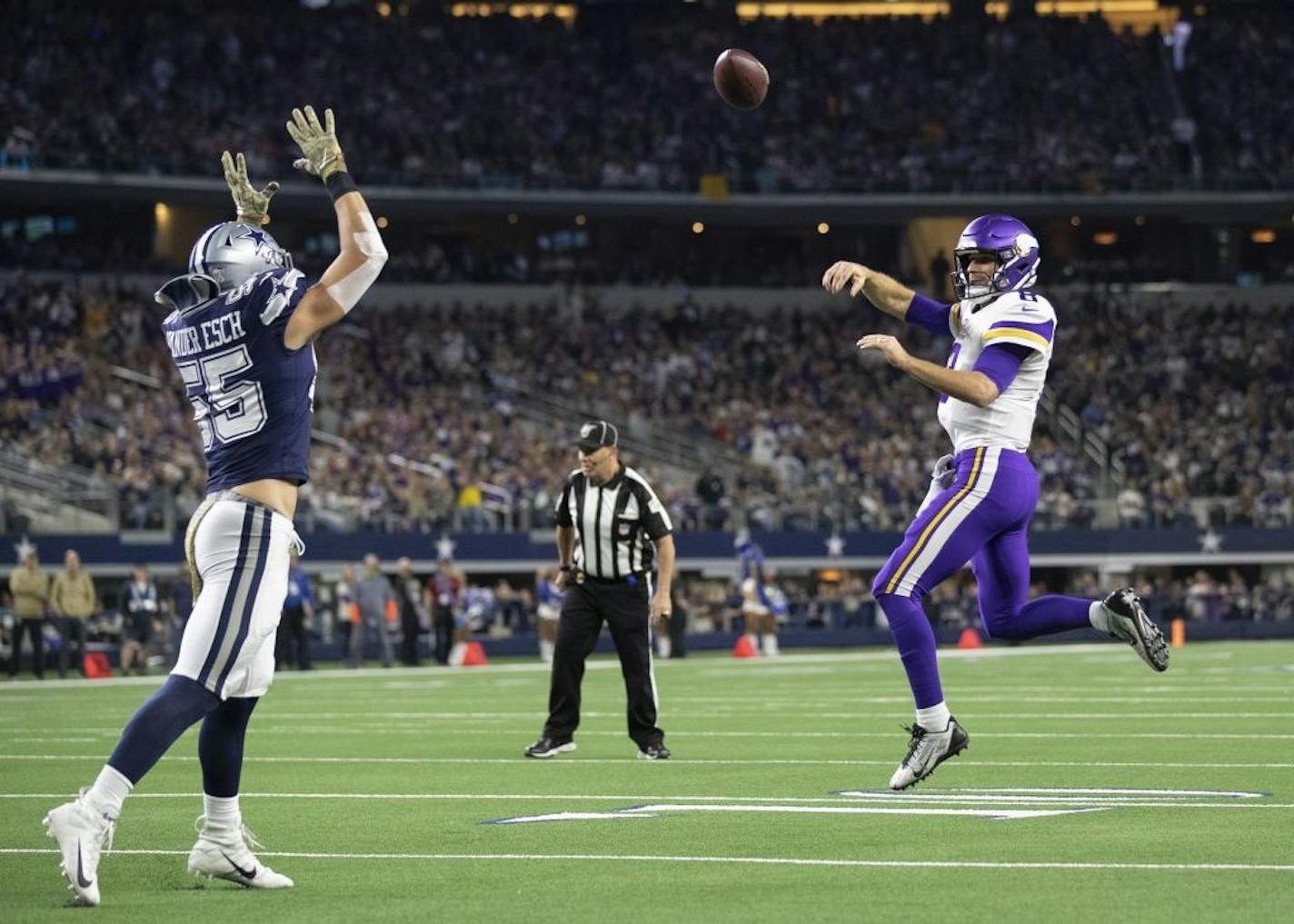 Minnesota Vikings quarterback Kirk Cousins (8) threw a first-quarter touchdown over Dallas Cowboys outside linebacker Leighton Vander Esch (55) to tight end Kyle Rudolph (82)