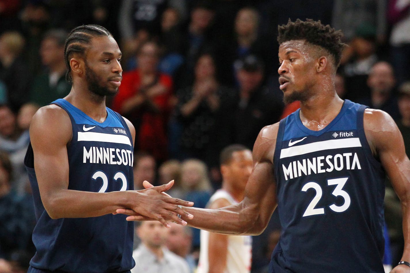 Timberwolves forward Jimmy Butler is congratulated by guard Andrew Wiggins