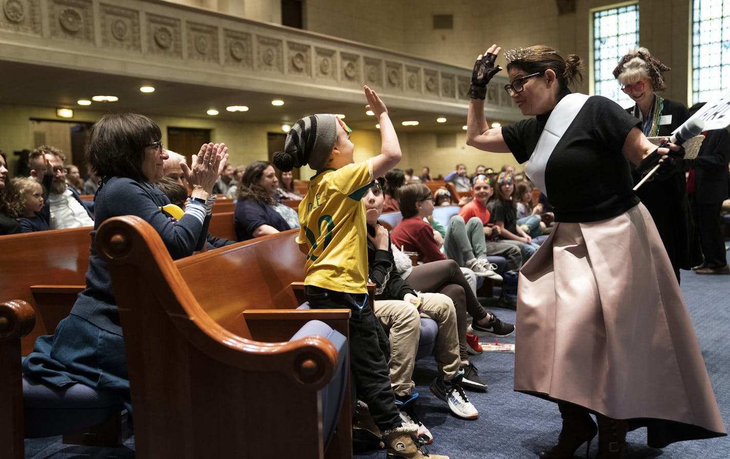 Rabbi Marcia Zimmerman gave Charlie Paton a high five after her answered a trivia question right during a service celebrating the festival of Purim at Temple Israel in Minneapolis, Minn., on Wednesday, March 20, 2019. ] RENEE JONES SCHNEIDER &#xa5; renee.jones@startribune.com