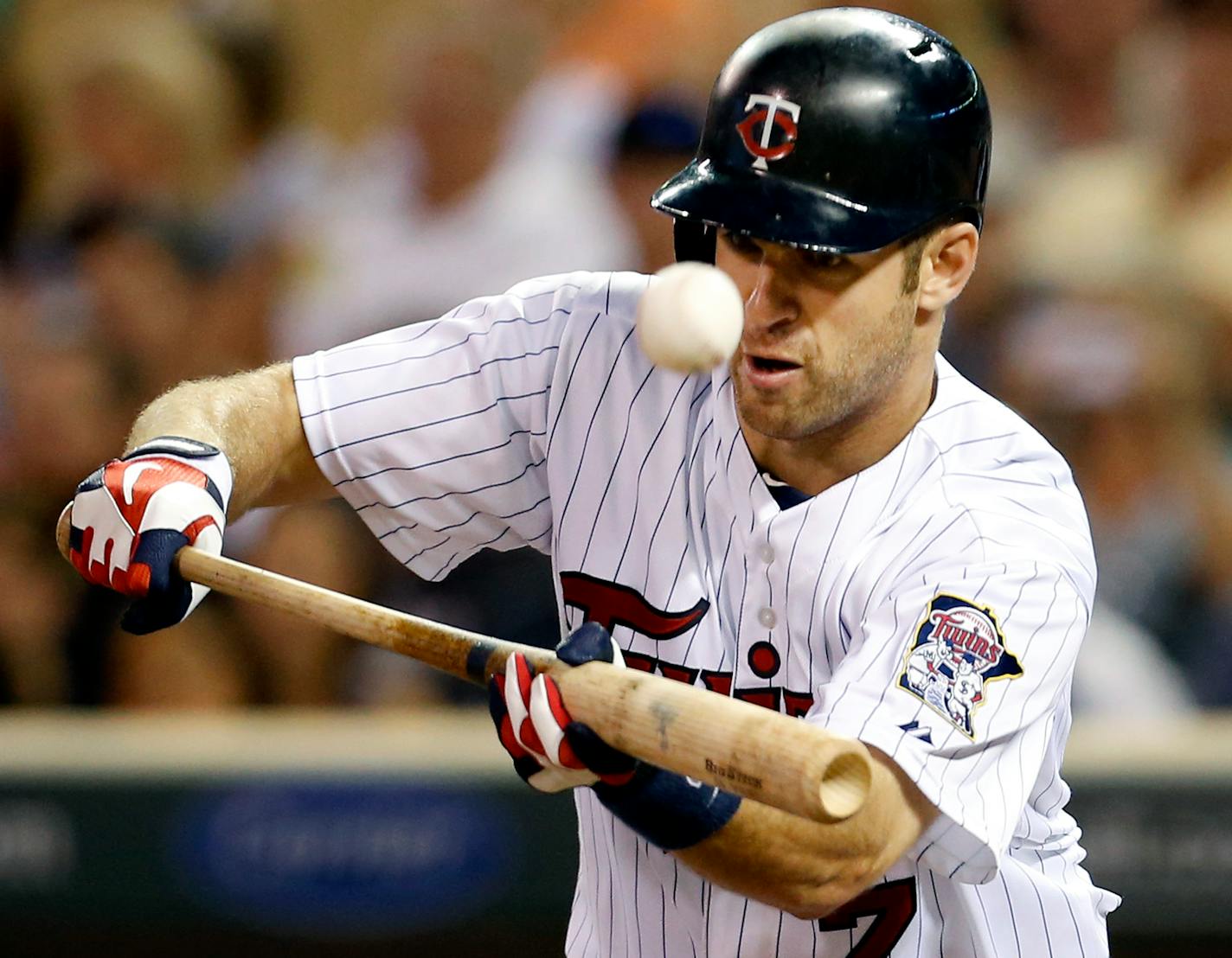 Minnesota Twins catcher Joe Mauer (7) attempted to bunt the ball in the eighth inning. ] CARLOS GONZALEZ cgonzalez@startribune.com June 27, 2013, Minneapolis, Minn., Target Field, MLB, Minnesota Twins vs. Kansas City Royals