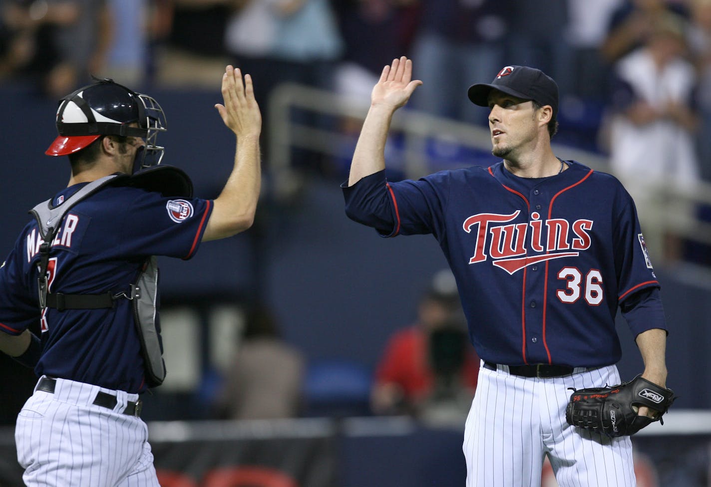 A scene that the Twins have become accustomed to, and figure to keep seeing for years: Joe Mauer and Joe Nathan high-fiving after a victory.