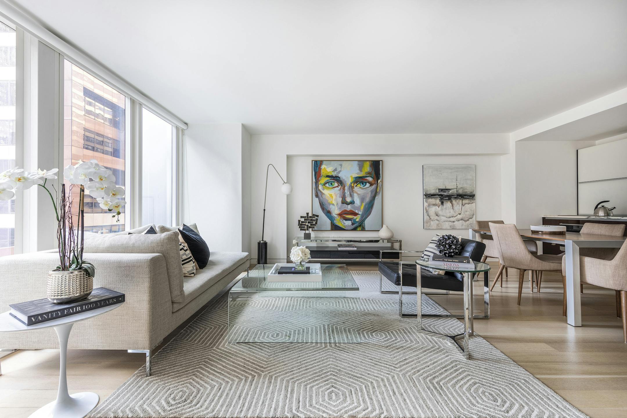 An open floor plan is divided into zones for living and dining. (Design Recipes)