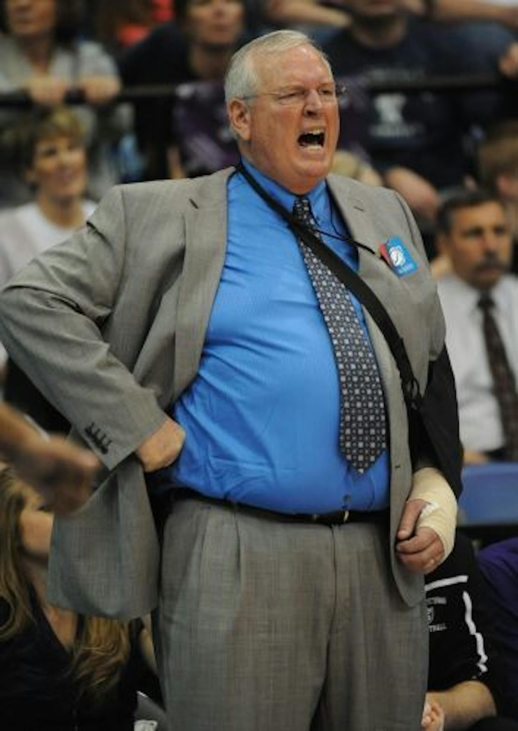 St. Thomas coach, Steve Fritz yells instructions during the first half of an NCAA Div III semifinal college basketball game against Middlebury at the Salem Civic Center in Salem, Va., Friday March 18, 2011.