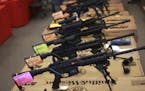 FILE &#xf3; Smith & Wesson AR-15 rifles for sale at a gun show in Loveland, Colo., Oct. 11, 2014. An ordinance in Highland Park, Ill., bars AR-15s and