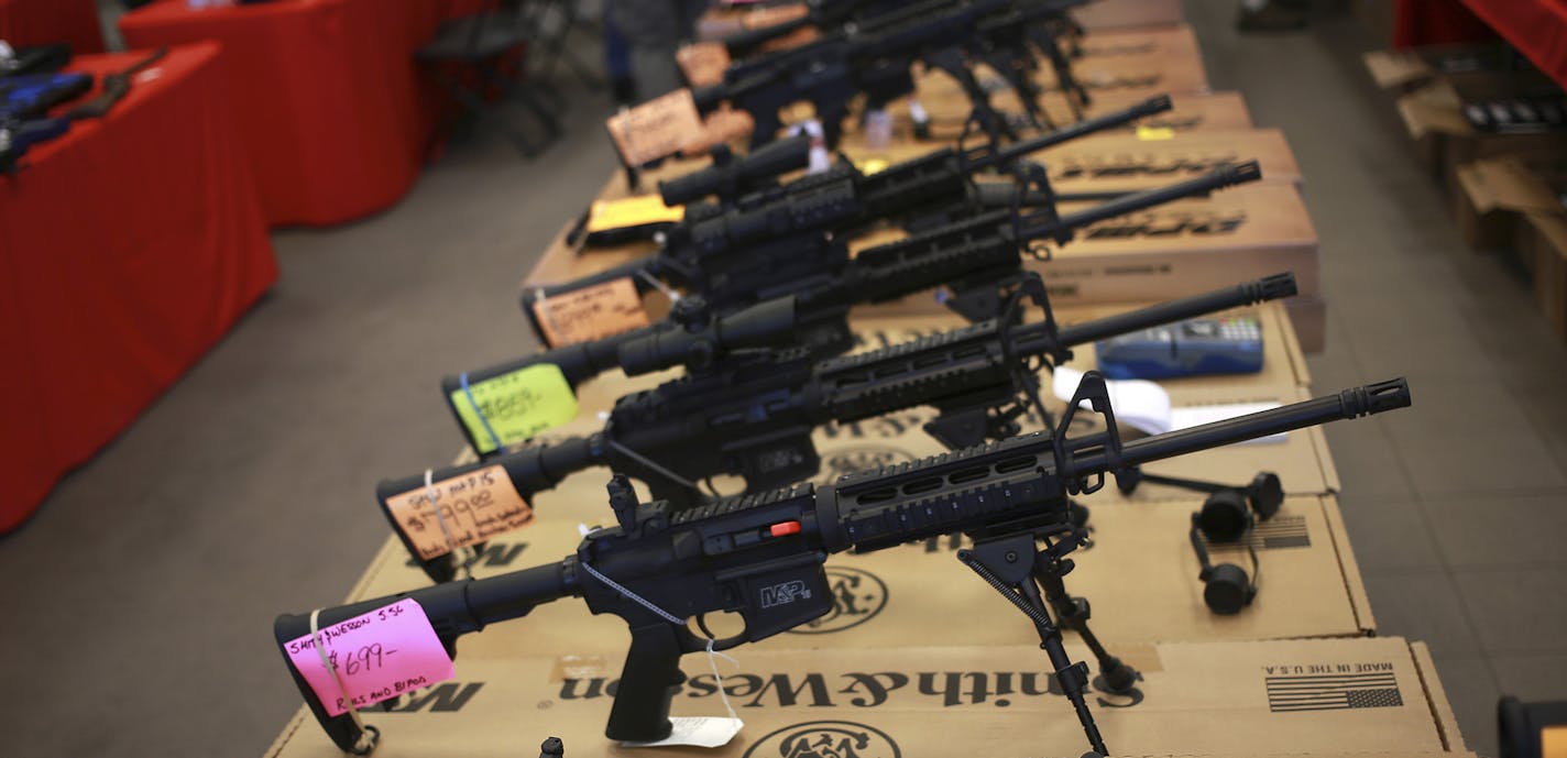 FILE &#xf3; Smith & Wesson AR-15 rifles for sale at a gun show in Loveland, Colo., Oct. 11, 2014. An ordinance in Highland Park, Ill., bars AR-15s and other semiautomatic guns that can accept large-capacity magazines. The Supreme Court on Monday, Dec. 7, 2015, refused to hear a Second Amendment challenge to the ordinance. (Luke Sharrett/The New York Times) ORG XMIT: MIN2015122917324649