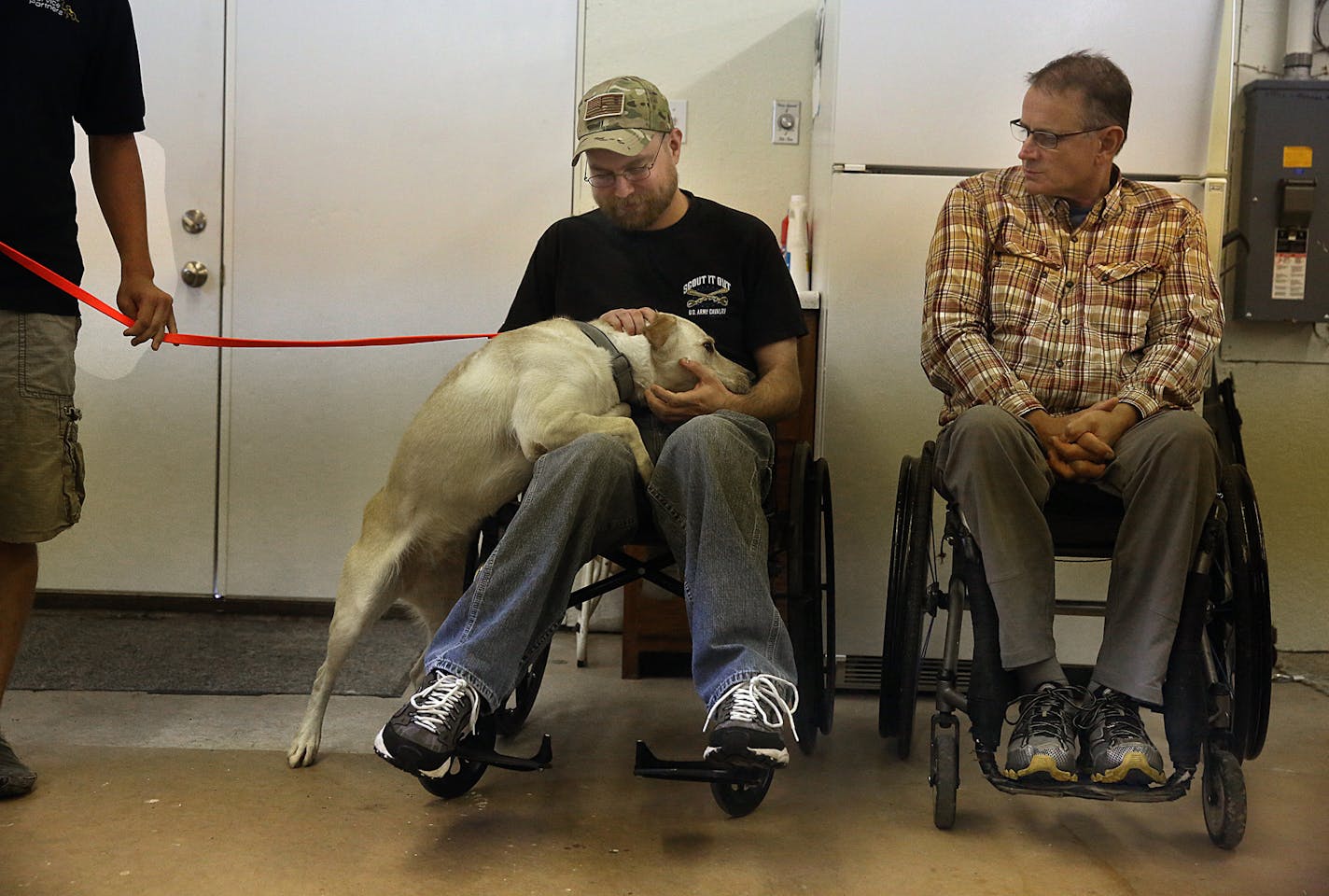 Kristian Gaasland was greeted by Claire, a service dog he has been training with. Gaasland served as a Sargent in the U.S. Army, and was deployed in Iraq in 2004-2005. Gaasland, who suffers from PTSD, hopes to take the dog home once training is completed. At right is Dave Guzzi, a volunteer at BELIEVEVET. ] JIM GEHRZ &#xef; james.gehrz@startribune.com / Northfield, MN / August 19, 2015 / 10:00 AM &#xf1; BACKGROUND INFORMATION: Sam Daly had a successful and lucrative career training hunting dogs