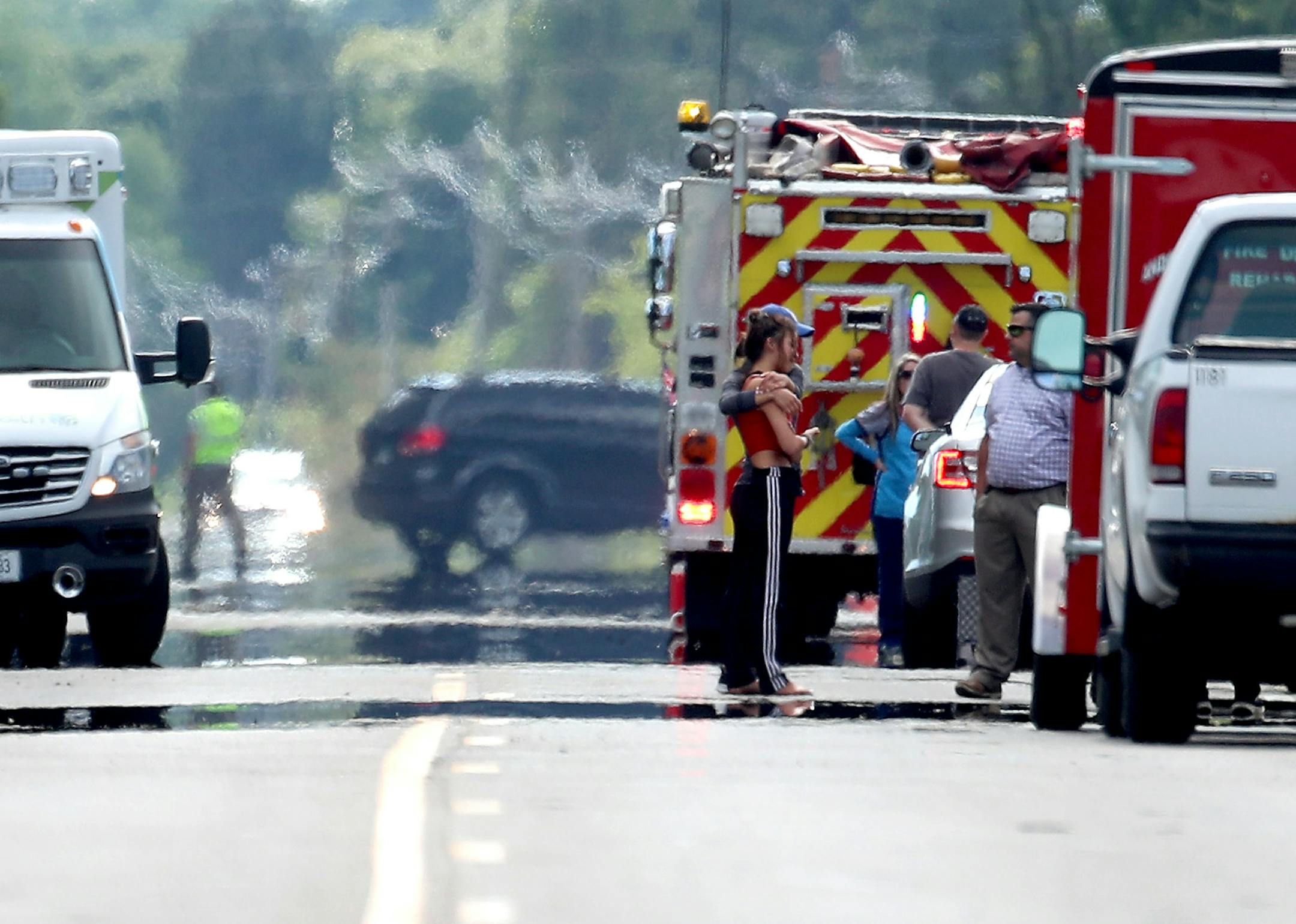 People near the scene of a fire and person barricaded nearby Wednesday in Andover.] DAVID JOLES • david.joles@startribune.com A SWAT team surrounded someone barricaded in a trailer Wednesday morning on property in Andover, as a home burned nearby and law enforcement kept firefighters at a distance during the standoff.