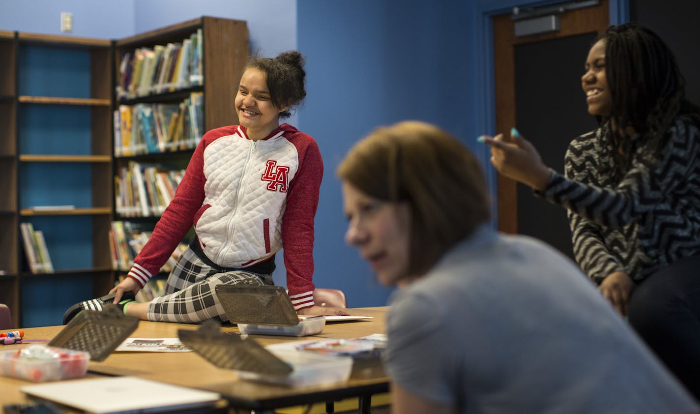 Students Takeela Wood, left, and Jerbrina Cooper and teacher Theresa Behnke, foreground, talked about their dreams for the future.