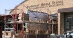 Construction at Rosemount Middle School, where workers are finishing up a new secure entryway. ] Minnesota schools are opening the new school year wit