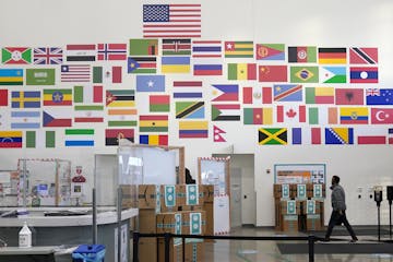 Amazon's Shakopee distribution center has 1,500 workers with ties to 64 countries. Flags in the entryway represent some of them.