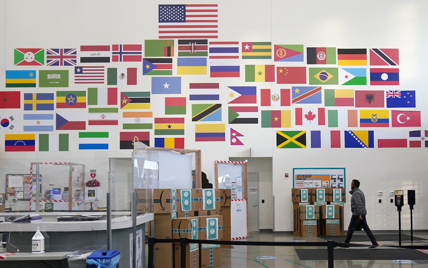 Amazon's Shakopee distribution center has 1,500 workers with ties to 64 countries. Flags in the entryway represent some of them.