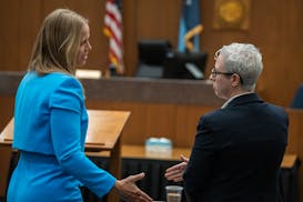 Leita Walker, attorney for MNCOGI and Sarah Riskin, assistant city attorney for Minneapolis shook hands after they presented oral arguments in front o