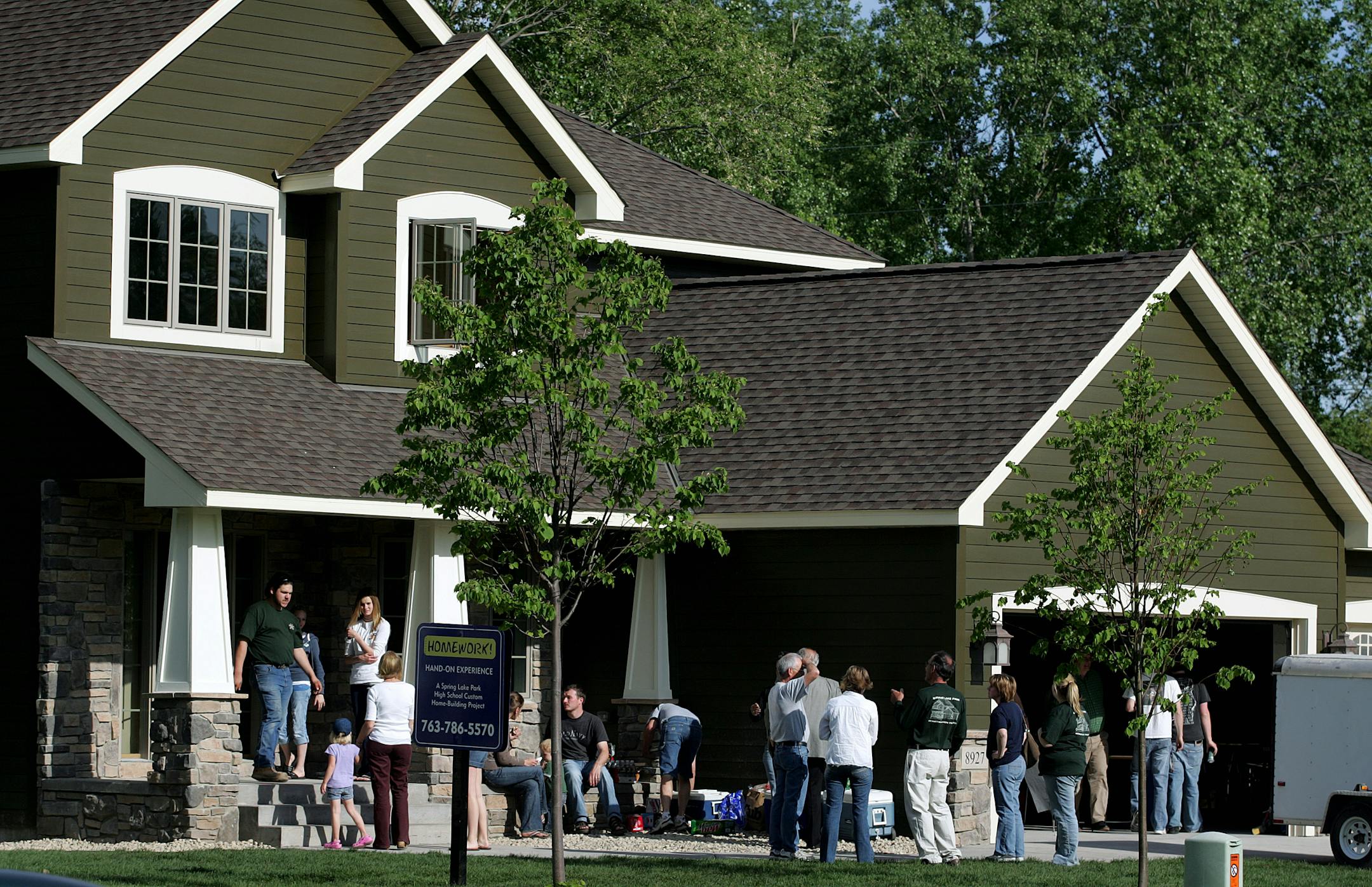 The public attending the open house on Wednesday toured the house in Blaine built by students in Spring Lake Park High School's Construction Trades Program. The students will receive college credits at Alexandria Technical College.