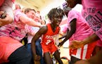 Students mobbed Agwa Nywesh after his last-second basket won a game for the Austin Packers. A "multicultural flowering" in the city and its schools wa