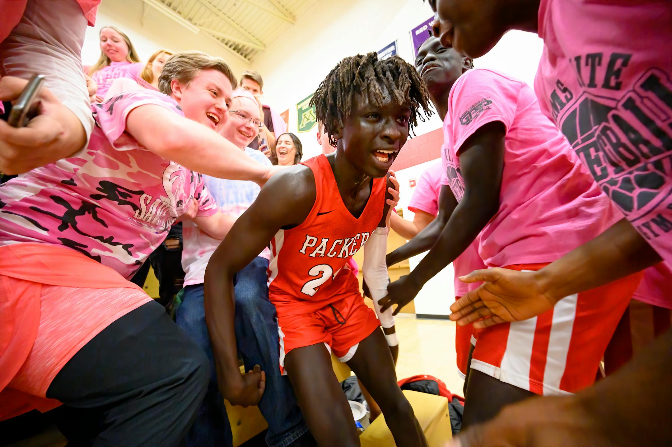 Students mobbed Agwa Nywesh after his last-second basket won a game for the Austin Packers. A "multicultural flowering" in the city and its schools was the subject of a Feb. 23 Star Tribune article.