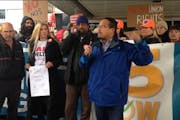 Kip Hedges stands next to Rep. Keith Ellison at a recent demonstration at the Minneapolis-St. Paul Airport.