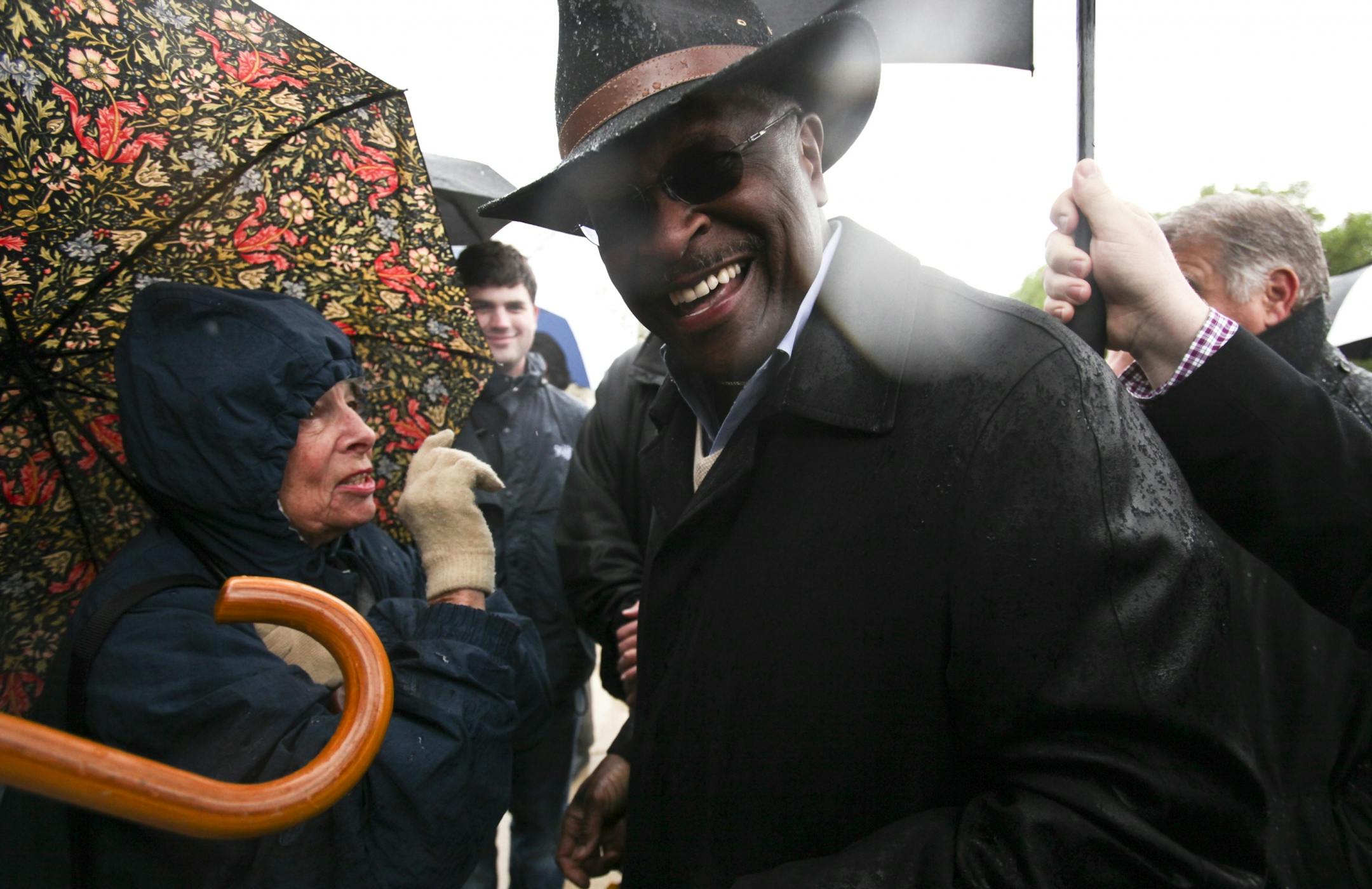 Herman Cain seemed thrilled to hear from a woman named Connie (only would give first name) whose daughter works at a TSA officer at the Atlanta Airport and who has met Cain on several occasions. Cain spoke at the rally outside the Capitol in St. Paul, MN, Saturday, April 28, 2012.