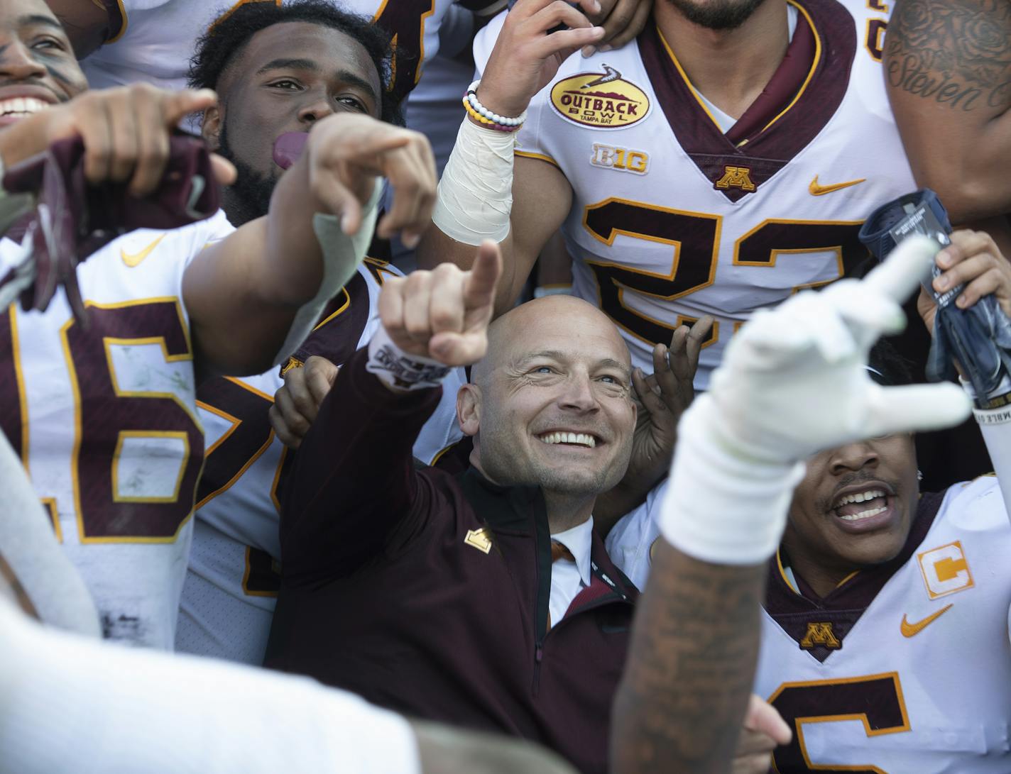 Minnesota Gophers head coach PJ Fleck celebrated with his players during a team photo following their victory against the Auburn Tigers. ] Aaron Lavinsky • aaron.lavinsky@startribune.com The Minnesota Gophers played the Auburn Tigers in the Outback Bowl on Wednesday, Jan. 1, 2020 at Raymond James Stadium in Tampa, Fla.