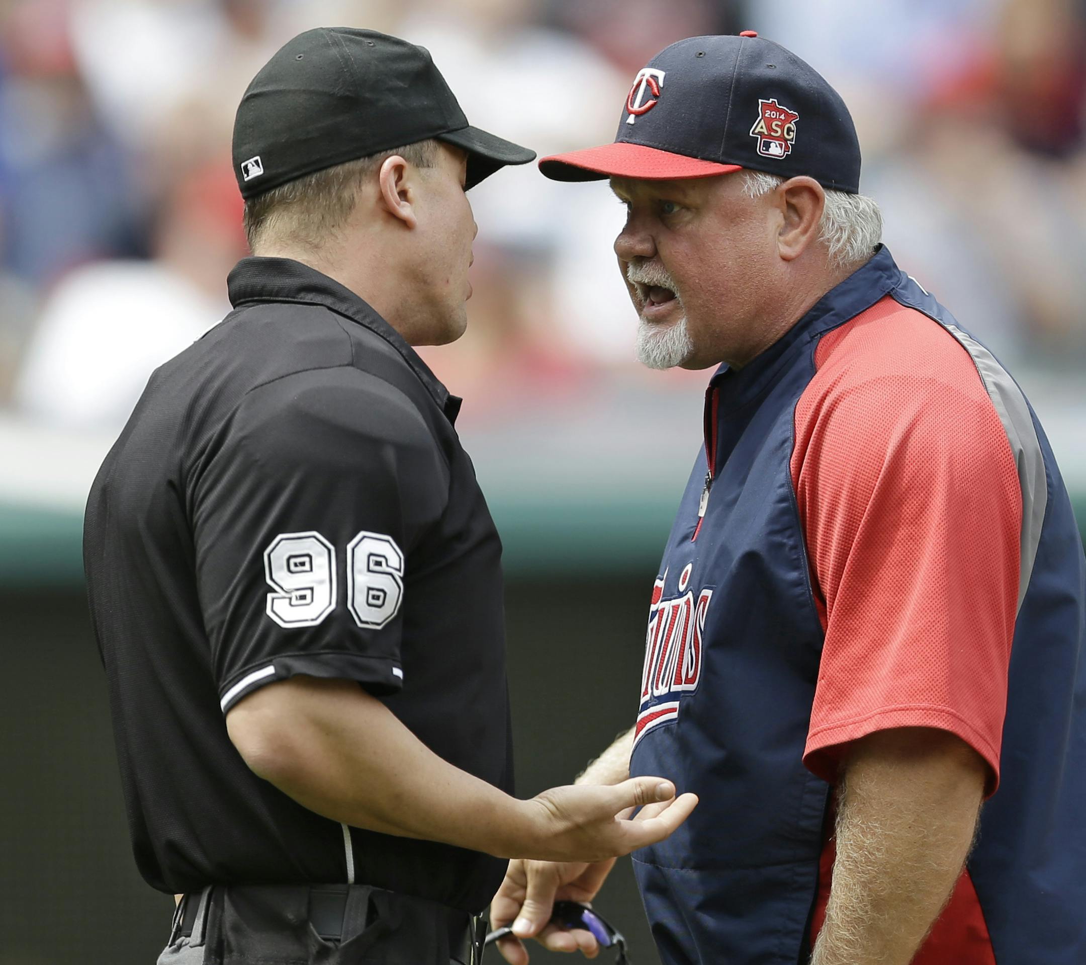 Minnesota Twins manager Ron Gardenhire, right, argues with home plate umpire Chris Segal in the third inning of a baseball game against the Cleveland Indians, Thursday, May 8, 2014, in Cleveland. (AP Photo/Tony Dejak)