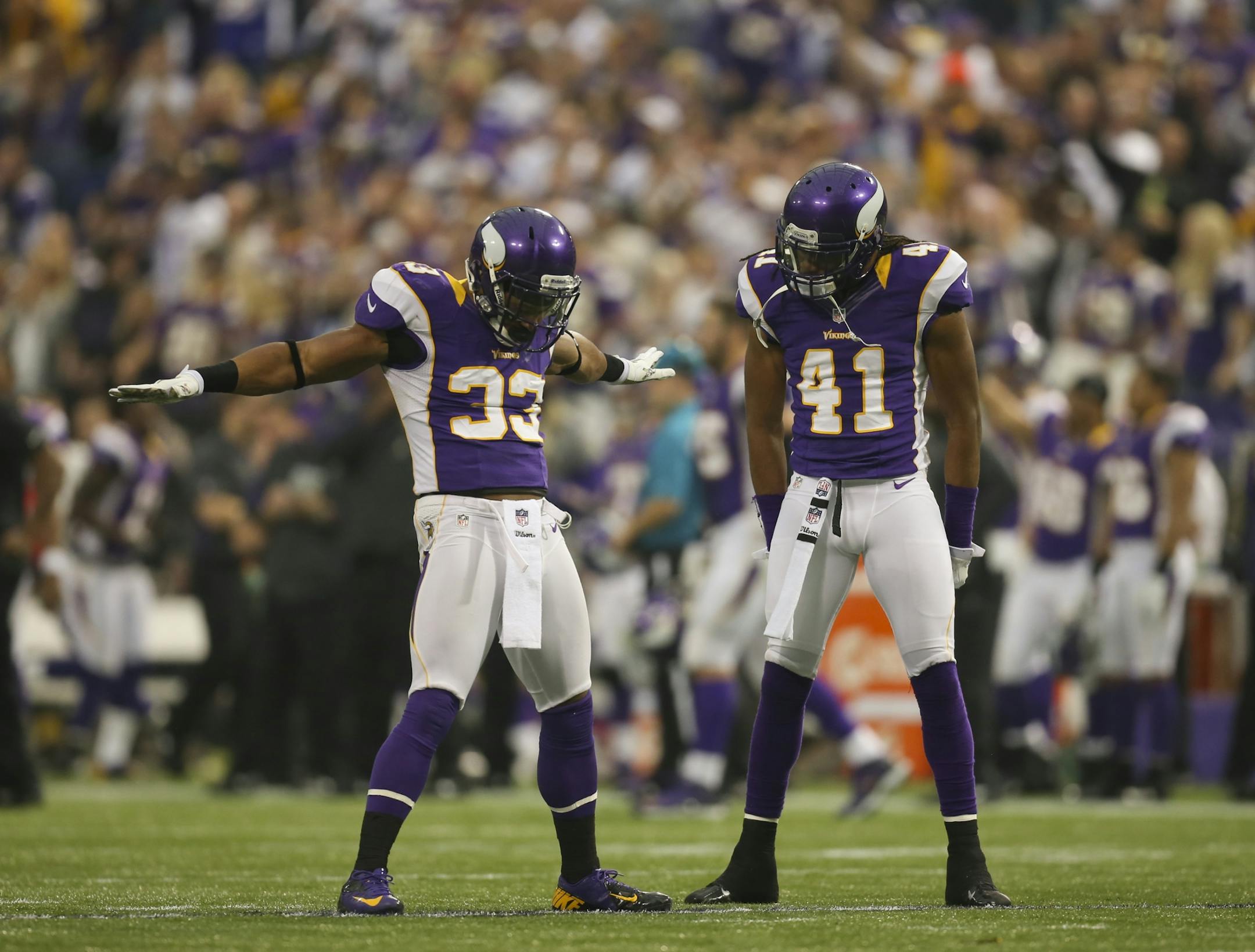 The Vikings' Jamarca Sanford, left, celebrated a turnover.