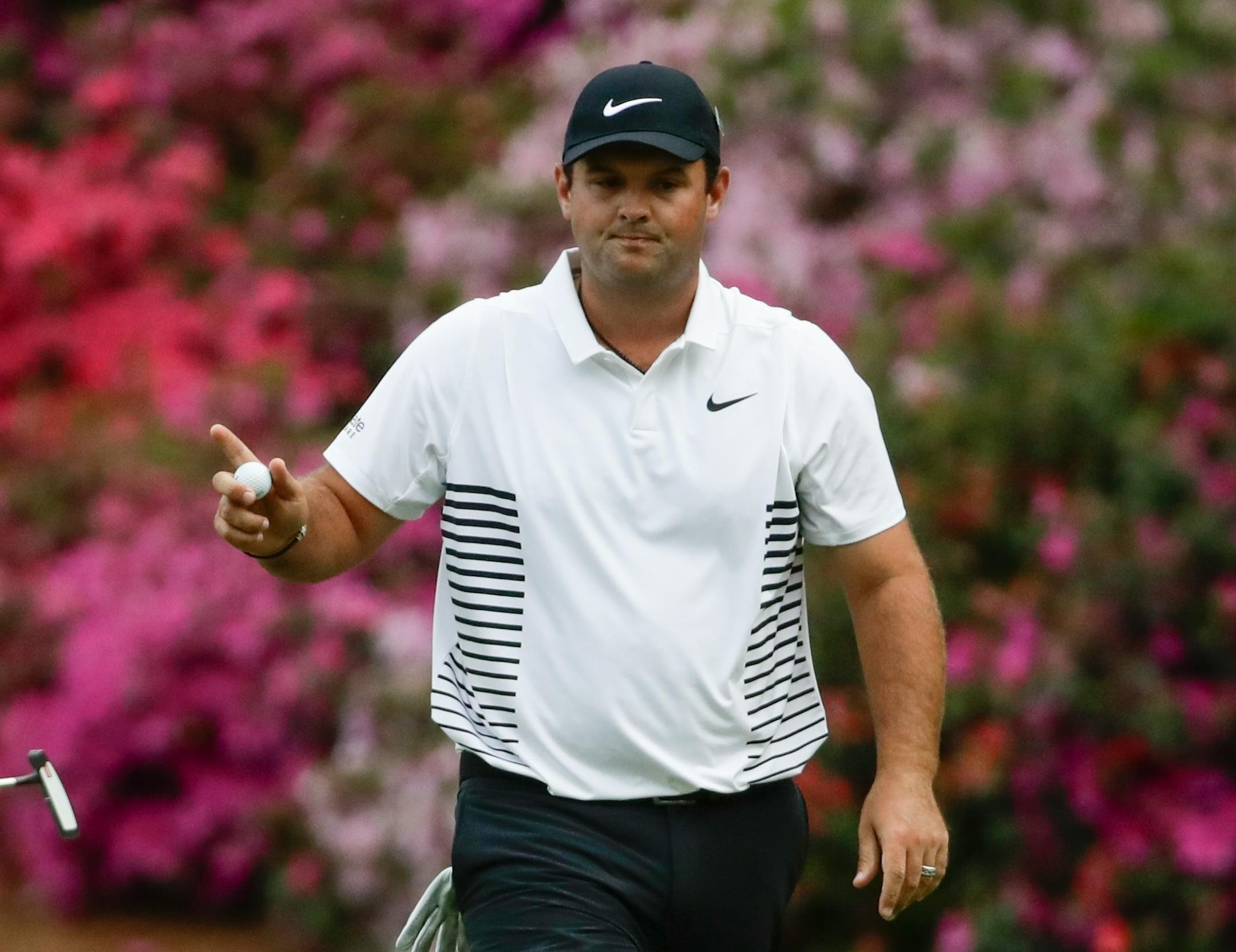 Patrick Reed reacts after making a birdie putt on the 13th hole during the second round at the Masters