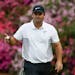 Patrick Reed reacts after making a birdie putt on the 13th hole during the second round at the Masters