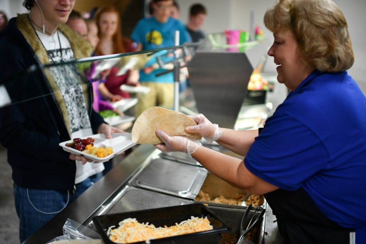 A cafeteria worker made burritos at Owatonna High School cafeteria.