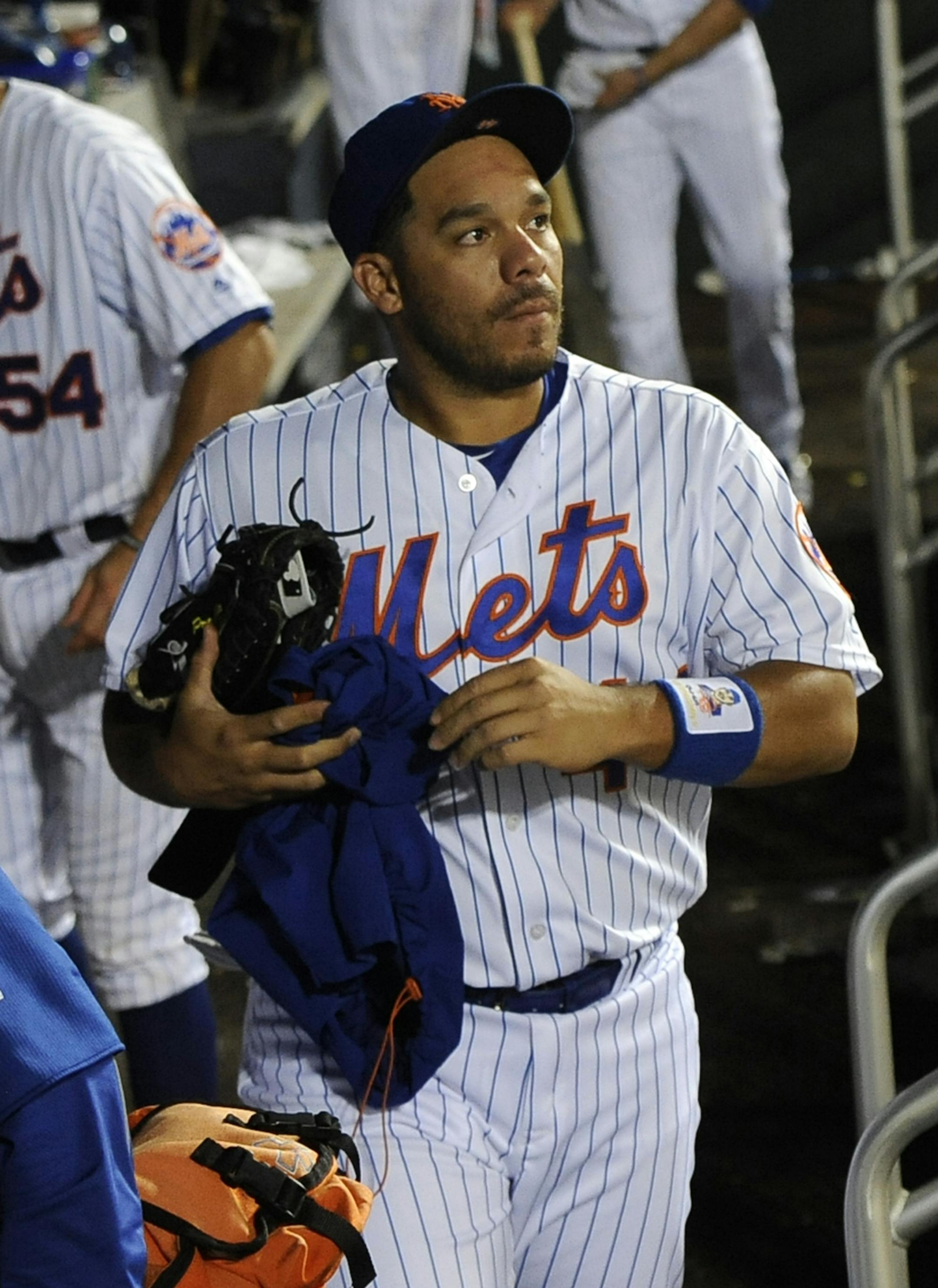 New York Mets catcher Rene Rivera looks toward the field as he leaves the dugout with teammates after a loss to the San Diego Padres in a baseball game, Friday, Aug. 12, 2016, in New York. (AP Photo/Kathy Kmonicek)